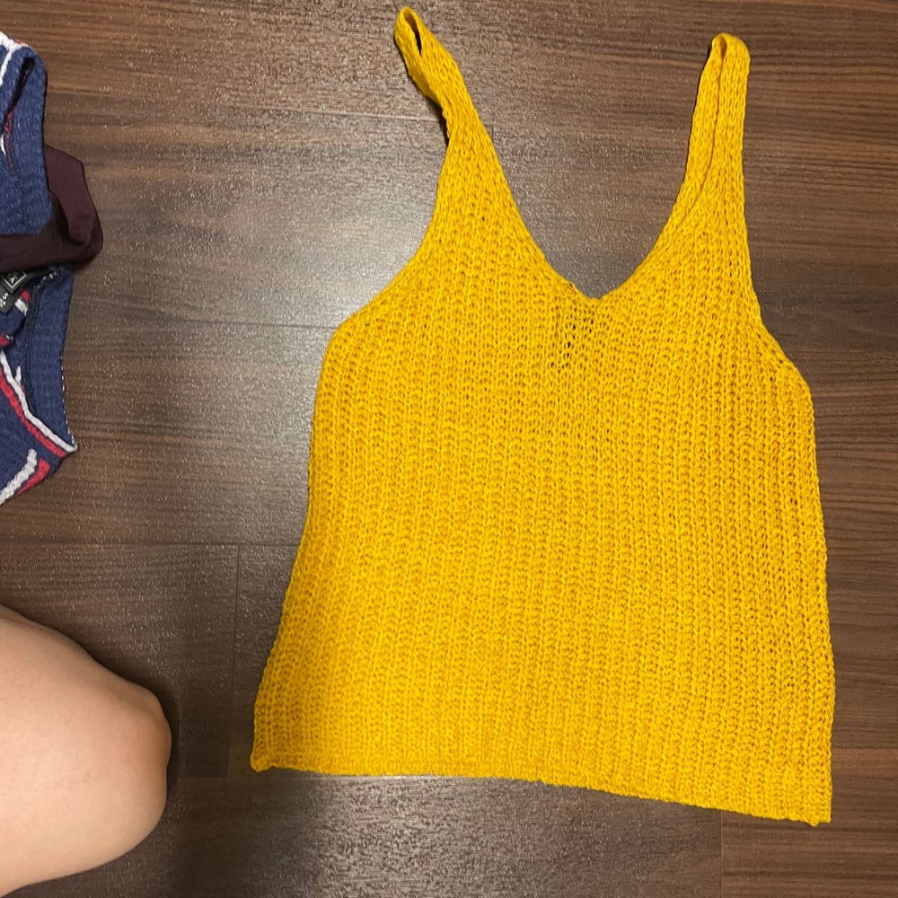 Bright yellow tank top.
